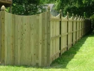 Solid Board Fence with A Dip And Gothic Posts